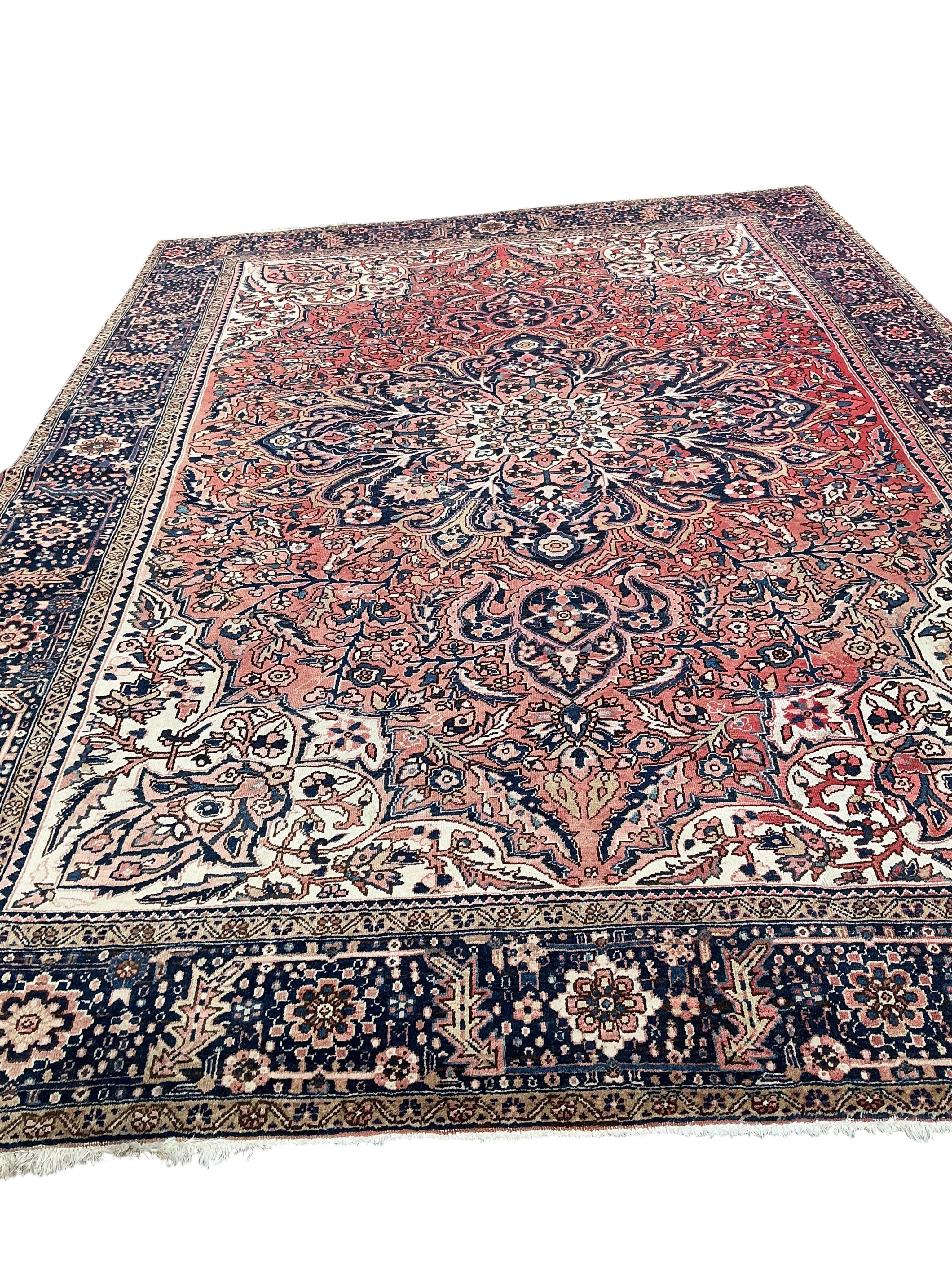 A Heriz red ground carpet, 295 x 270cm